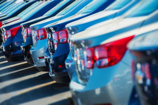 Parked Cars on a Lot. Row of New Cars on the Car Dealer Parking Lot. Cars Market Theme.