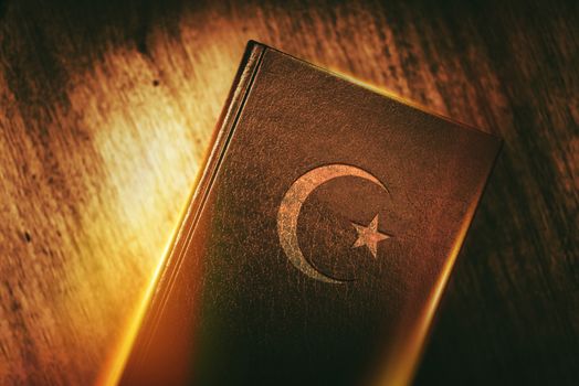 Islam Concept Book with Star and Crescent. Quran Religious Text of Islam Concept Photo.