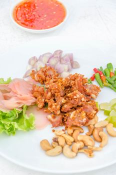 Deep fried sour fermented chicken knees tendon served with vegetables  sliced