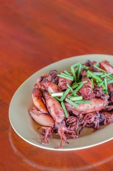 plate of sauteed small squid fried with garlic and sauce