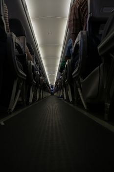 The aisle of an airplane seen during the flight