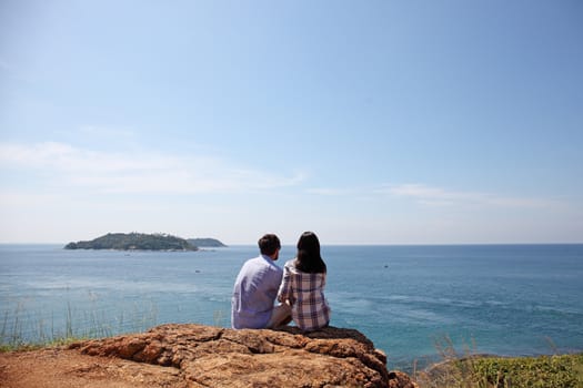 Young couple enjoy beautiful sea view on vacation