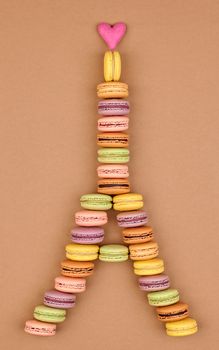 Macarons Eiffel Tower french sweet colorful, pink heart. Fresh pastel delicious dessert on chocolate retro vintage background. Love,Valentines Day,romantic                                       