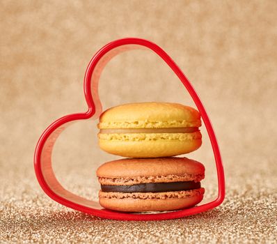 Valentines Day. Love. Red heart, Macaron french sweet delicious dessert yellow, chocolate. Vintage retro romantic style. Unusual creative art greeting card, gold background, copyspace