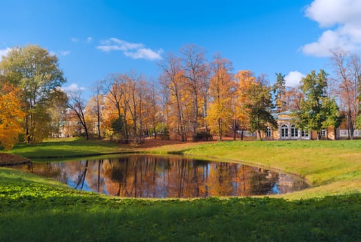 The palace on the shore of the pond in the park of Pushkin near St. Petersburg at autumn