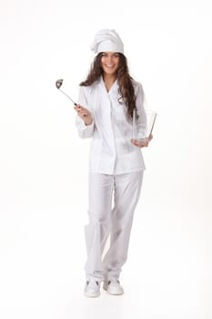 Young attractive woman in the cook uniform with a ladle