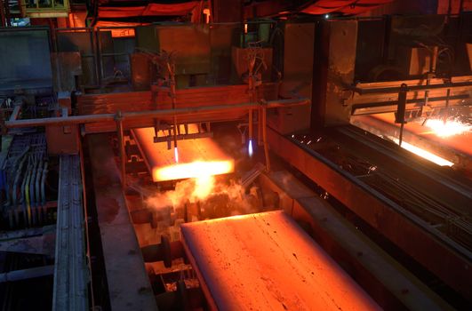 Gas cutting of the hot metal in a plant