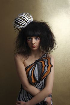 Beautiful Female Model With Exotic Make-up; Indoors