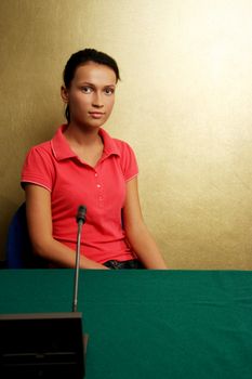 Casual girl at conference on gold background