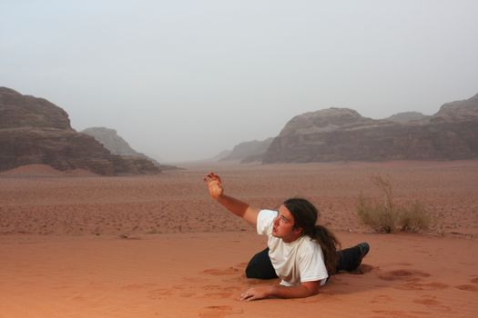 Desperate man in the desert longing for something