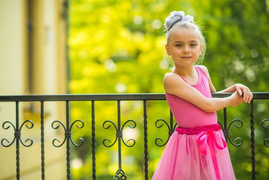 Little Girl in Pink Dress. Seven Years Old Caucasian Girl Ballet Dancer.
