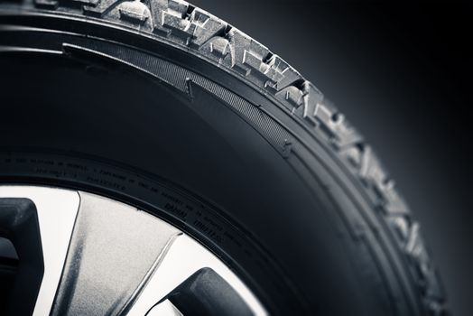 Off Road Tire and Alloy Wheel Closeup Photo. 