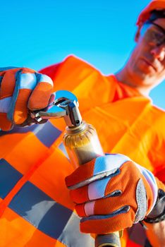 Plumber Worker with Wrench Fixing Some Elements of Plumbing System. Closeup Photo