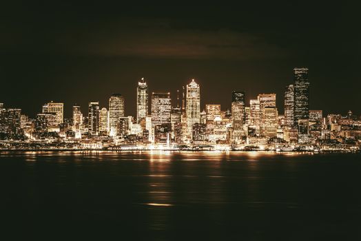 Golden Seattle Skyline at Night. Seattle and the Puget Sound in Golden Brown Elegant Color Grading.