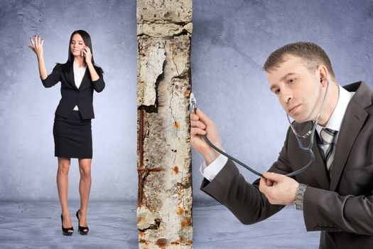 Businessman with stethoscope hearing grey wall with businesslady