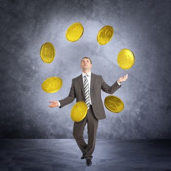 Businessman juggling big coins on abstract grey background