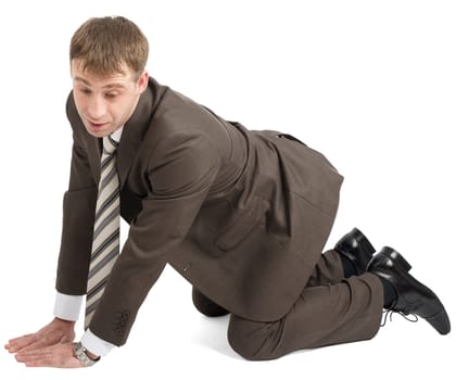 Businessman on knees and arms looking down isolated on white background