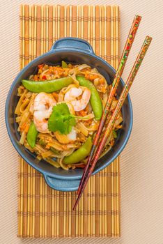 Serving of pad thai photographed from overhead.