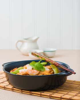 Serving of shrimp pad thai photographed closeup.