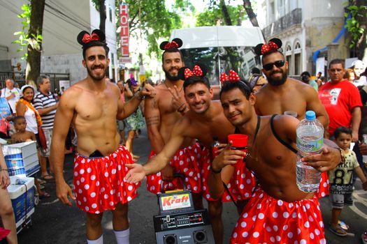 BRAZIL, Rio de Janeiro: Men dress up as Minnie Mouse as thousands of revelers take over the city on January 23, 2016 in a massive street party two weeks ahead of Carnival.  In the weeks leading up to the Carnival's official opening day on February 5, 2016, groups of people organize 'blocos', or street parties. Blocos are usually held in local neighbourhoods and feature brass bands and are much less formal than the parades.	 