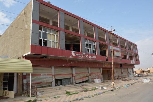 IRAQ, Al-Seneia: A building is damaged is visible on January 22, 2016, after ISIS destroyed much of the city of Al-Seneia. The city was liberated on October 14, 2015, according to commander of Imam Ali brigade who spoke with our contributor. ISIS is said to have destroyed much of the town including important building such as schools and hospitals.
