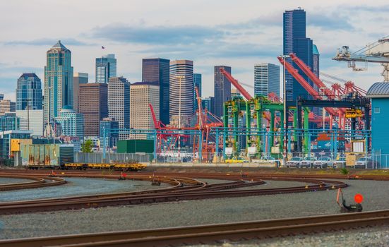 Port of Seattle District Cargo Ships Lifts, Railroad Tracks and the Seattle Skyline. Seattle, Washington, United States.