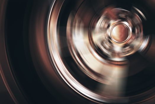 Spinning Car Wheel Closeup Photo. Car Alloy Wheel in Motion.