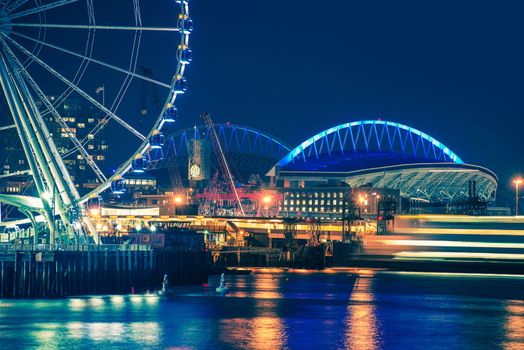 Seattle Waterfront and Illuminated Ferris Wheel at Night, Seattle, Washington, United States.