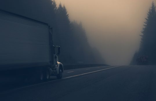 Trucks on the Foggy Highway in Northern California, United States. Foggy Day on the Road