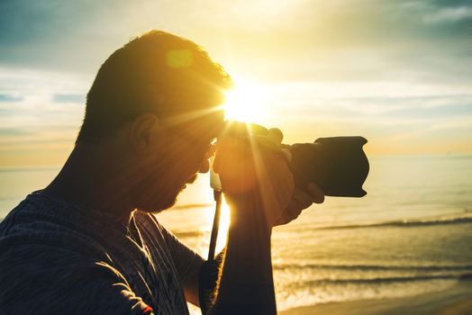 Learning Photography at Sunset. Photographer Practicing Taking Pictures. 