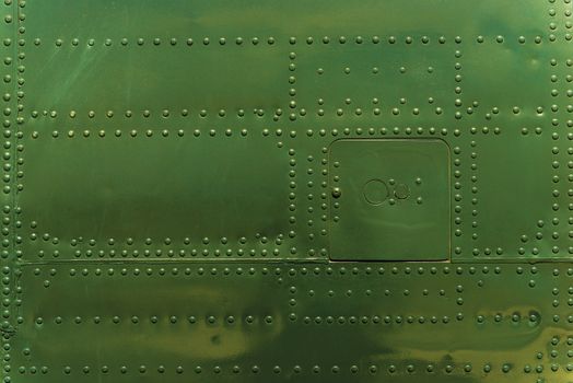 Rivets and Metal Background Dark Green Painted. Metal Military Grade Backdrop