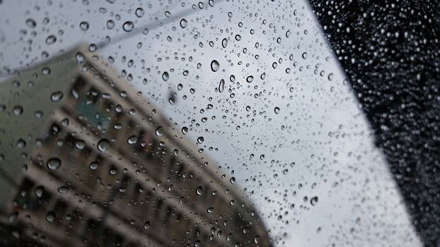 Vision at the window's car in the rainging day. during the traffic. 