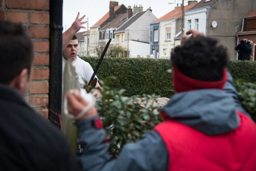 FRANCE, Calais: A man holds a rifle he just pointed at migrants and demonstrators during a demonstration supporting migrants and refugees on January 23, 2016 in Calais, northern France.