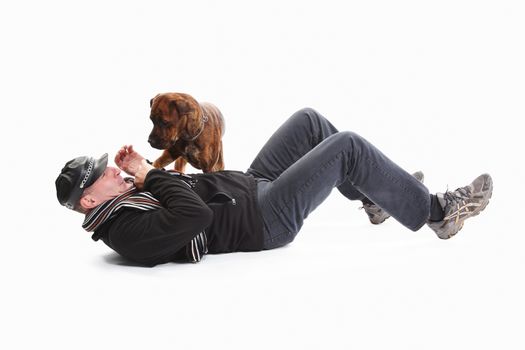 Mature Man Lying On Back With Dog Over White Background