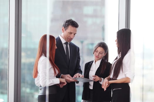 Group of business people using tablet in office