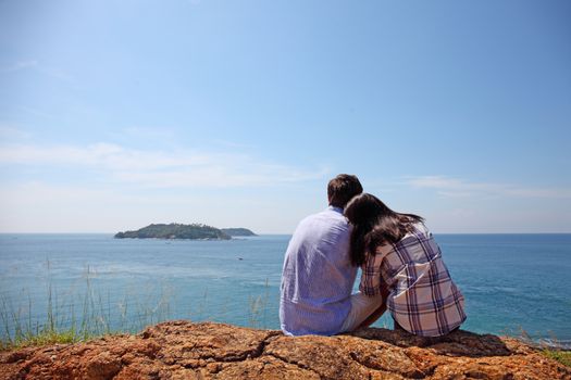 Young couple enjoy beautiful sea view on vacation