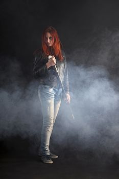 Portrait Of Woman Holding Stick In Smoke