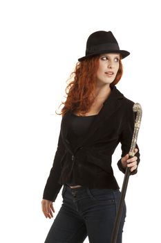 Serious red hair lady with a hat and special walking stick (contrast lightning)