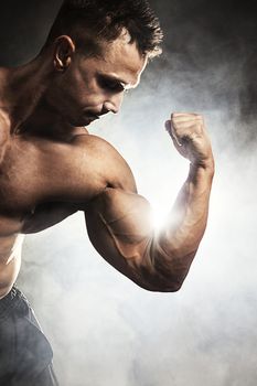 Male bodybuilder flexing his muscles