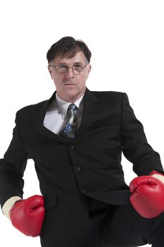 Mature Businessman With Boxing Glove Isolated Over White Background