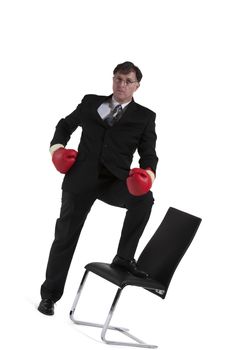 Mature Businessman With Boxing Glove Isolated Over White Background