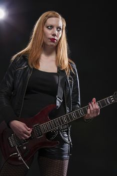 Young Blonde Woman Playing Guitar; Indoor