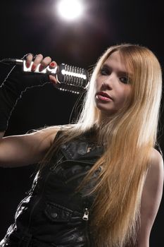 Young Woman Singing In Microphone; Indoors