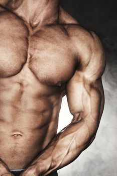 Mid-section of muscular bodybuilder