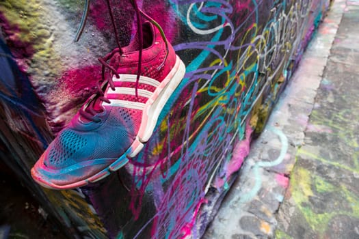 Painted shoe and Graffiti in one of Melbourne's most famous Laneways - Hosier Lane.