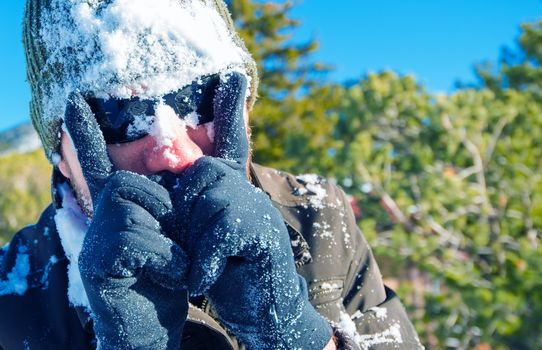 Winter Fun. Men in Sun Glasses Covered by Snow After Snow Fight.