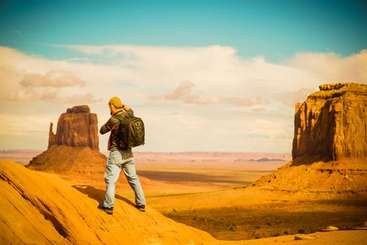 Travel Photographer at Work. Arizona Monuments Valley. Male Photographer.