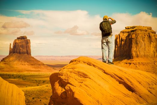 Nature Photography. Ambitious Young Photographer Taking Pictures in Monuments Valley, Arizona, United States.