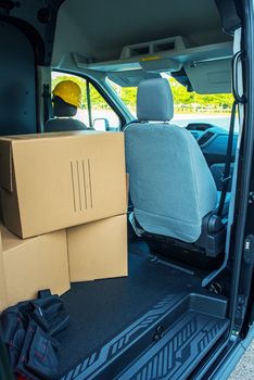 Courier Delivery. Open Large Van with Few Boxes Inside. Transportation and Logistic Theme.