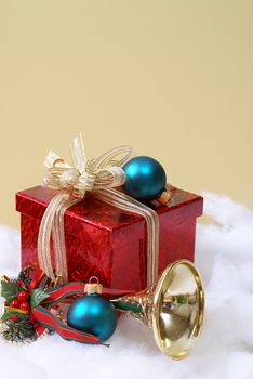 A decorative setting of the seasonal Christmas theme a nice red gift box.